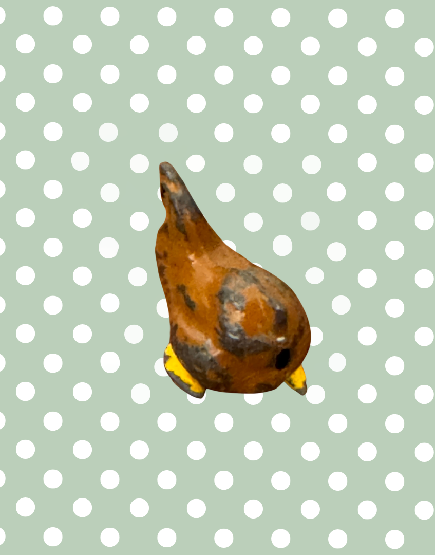 front view of antiue lead chicken figurine