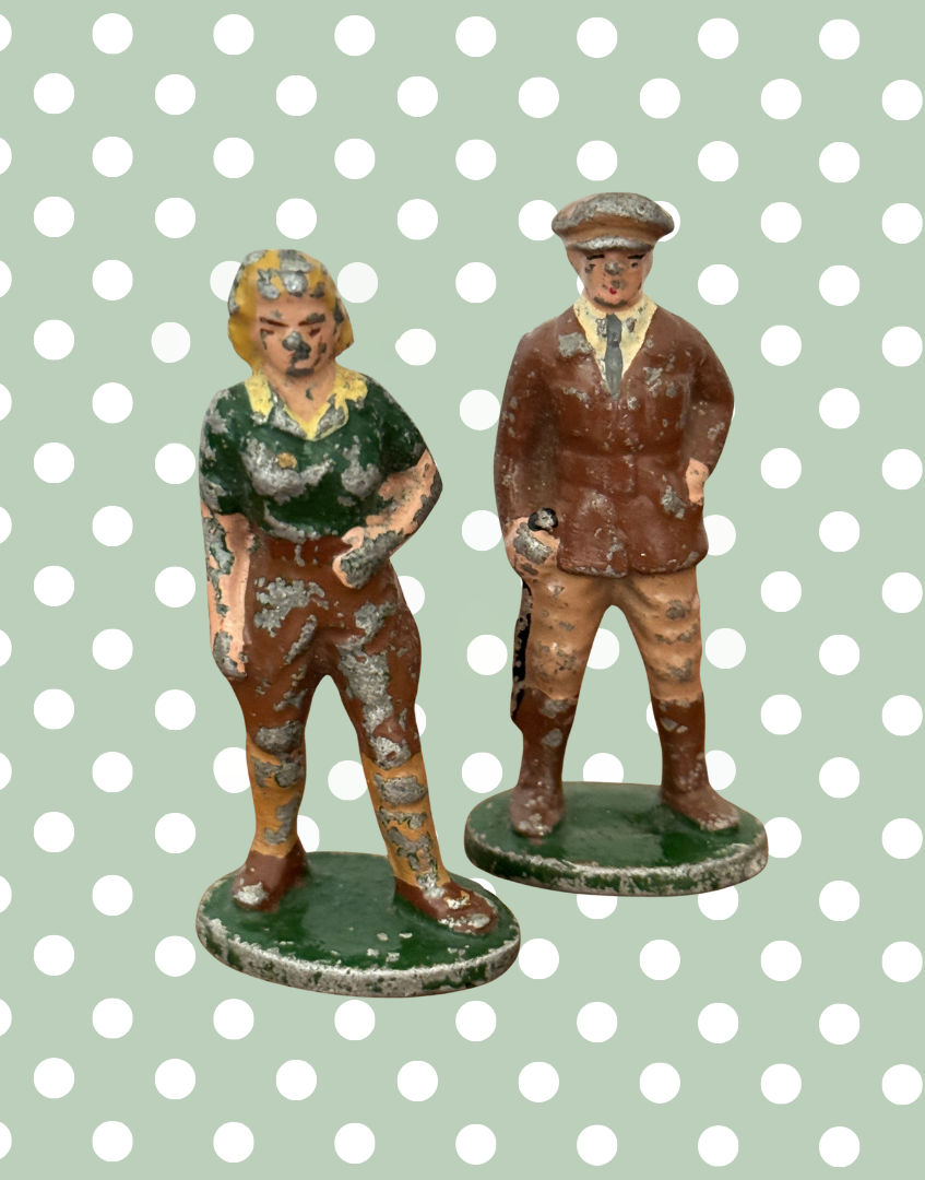 a pair of collectable lead farm character figurines