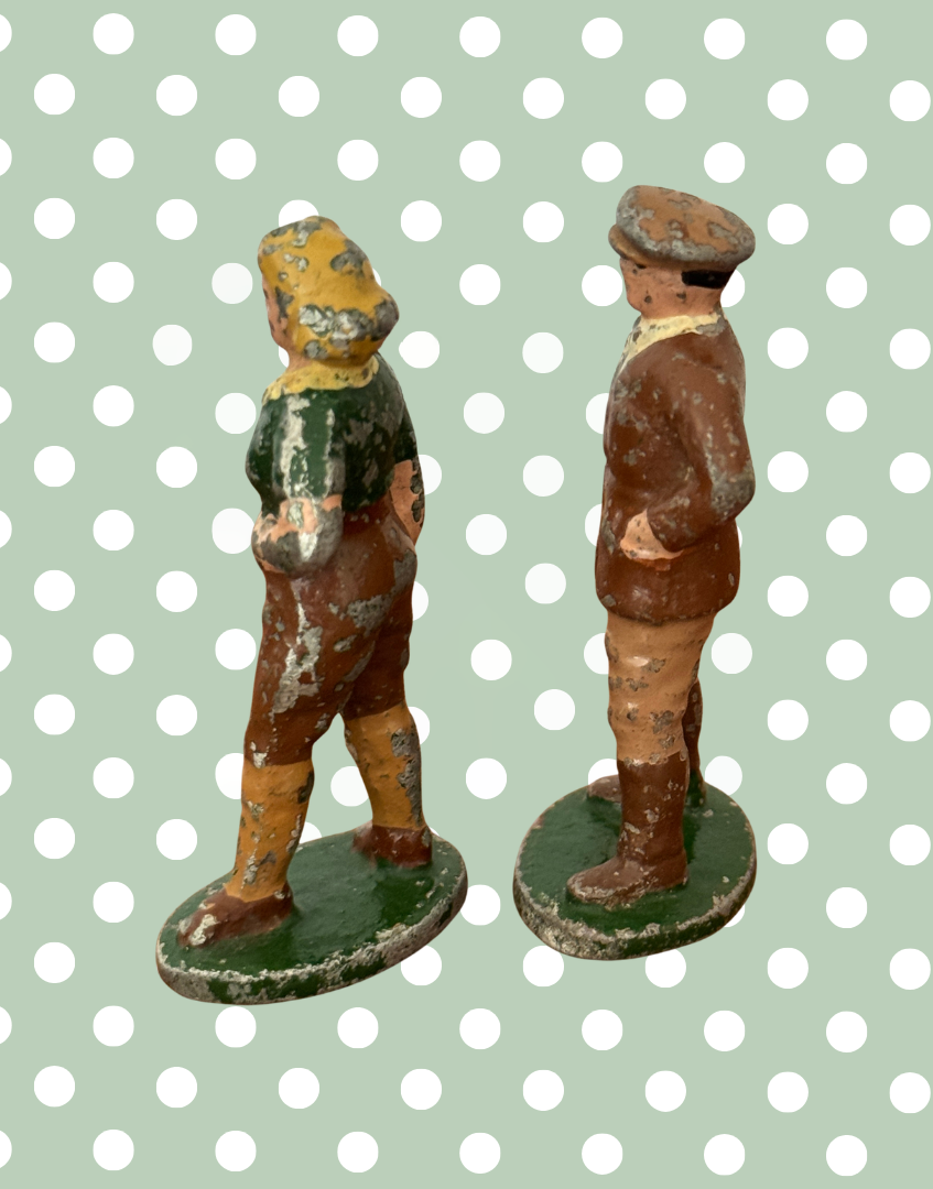 two vintage green and brown hand painted lead figurines