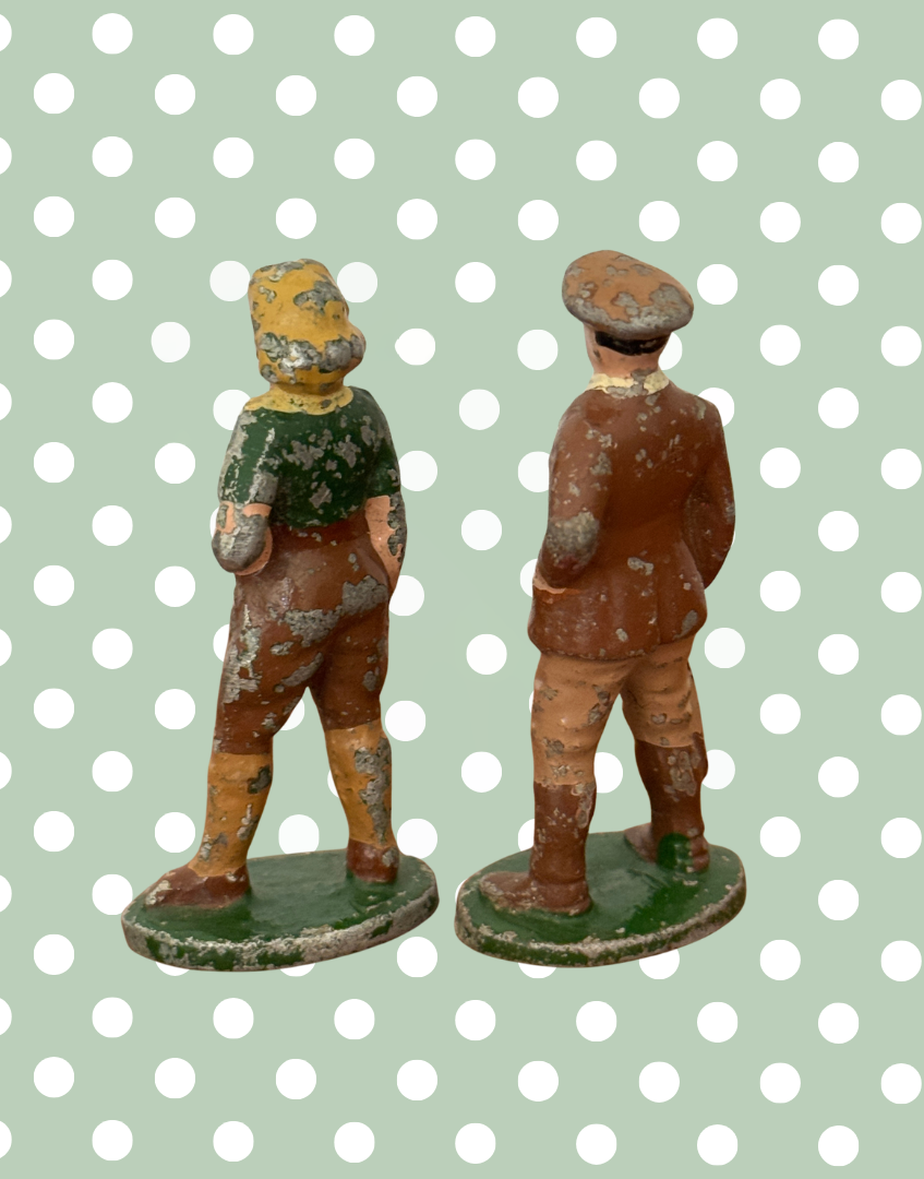 reverse side viewof vintage hand painted farm characters on green stand