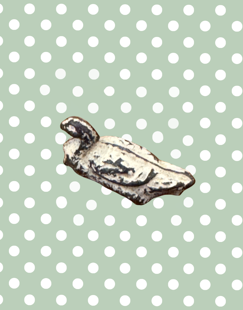top view of 1920s goose collectable lead toy