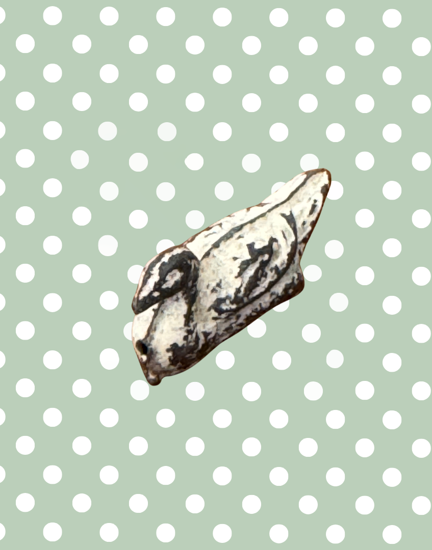 side view of antique bird figurine