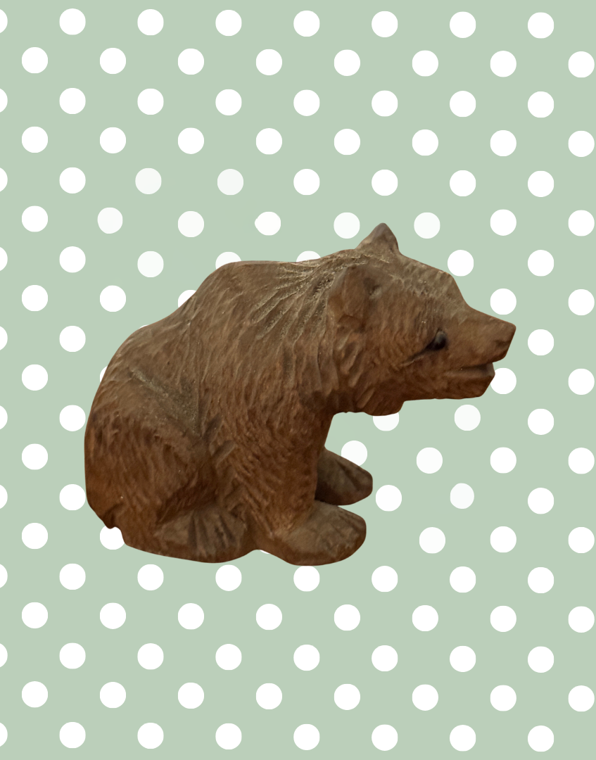 Antique German wooden bear figurine light wood tone side view