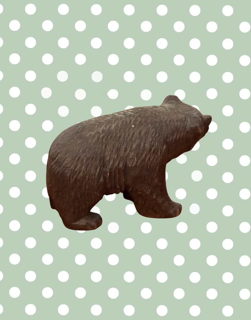 Side view of Black Forest carved wooden bear miniature figure with character
