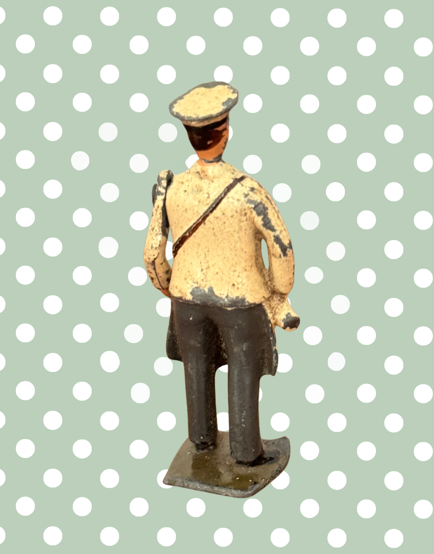 Back view of vintage collectable toy figure shelf styling detail