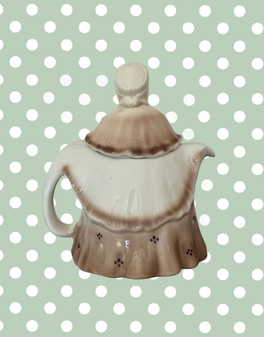 Reverse side of Tony Wood Little Old Lady teapot showing brown glazed dress and rear bonnet detail