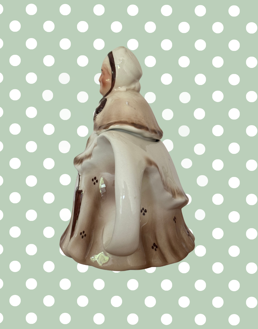 Characterful vintage Tony Wood Staffordshire Little Old Lady teapot with bonnet and shawl detail side view
