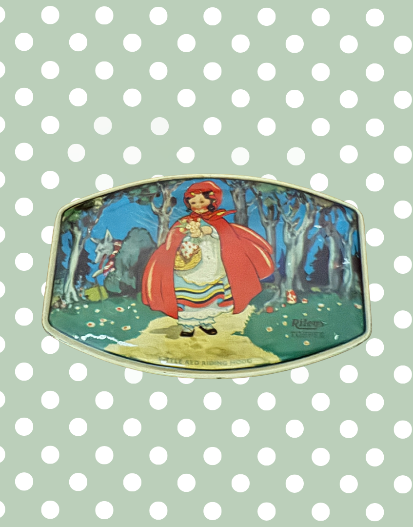 Art Deco era Rileys Toffee collectable tin showing Little Red Riding Hood carrying flowers with wolf hidden in woodland background