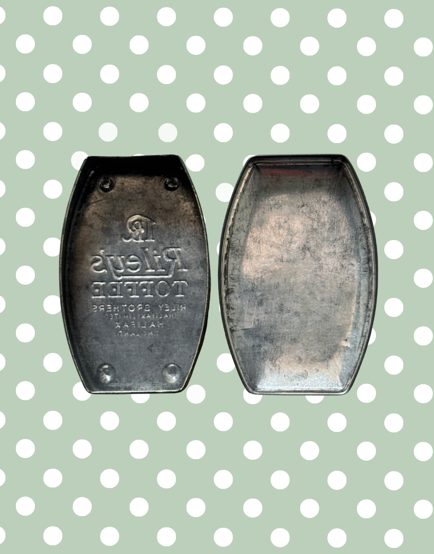 Interior view of vintage Rileys Toffee tin showing inside of tin and underside of lid with aged metal finish and original construction