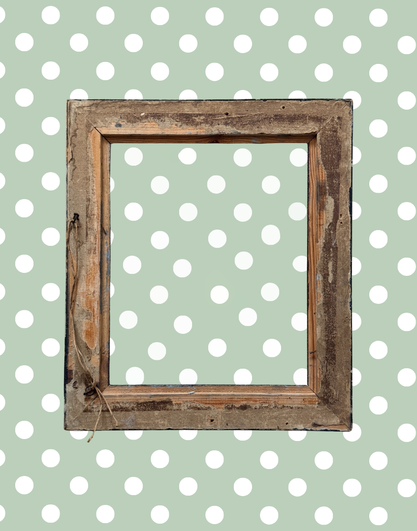 Back view of vintage empty picture frame with aged wood finish and worn hanging hardware.

