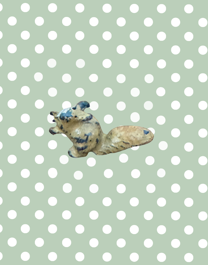 small figurine of a tiny squirrel lead toy collectable