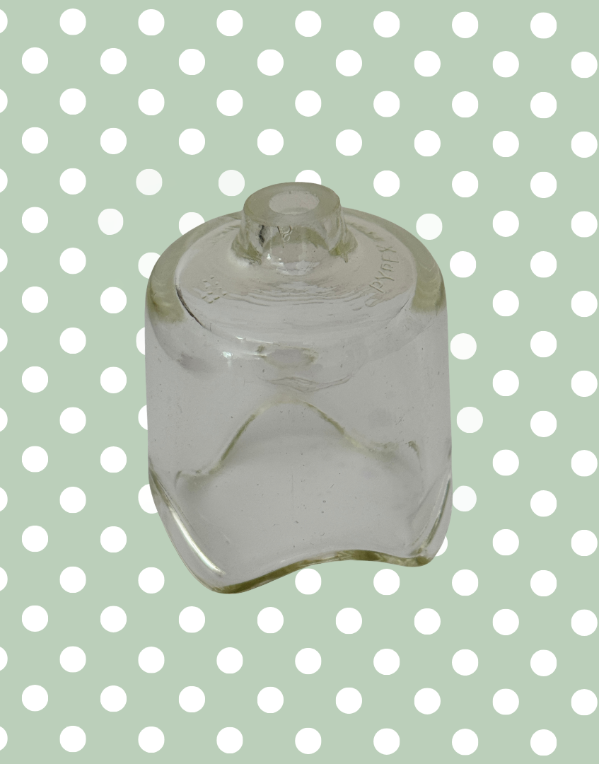 Vintage large Pyrex glass pie funnel for traditional home baking.