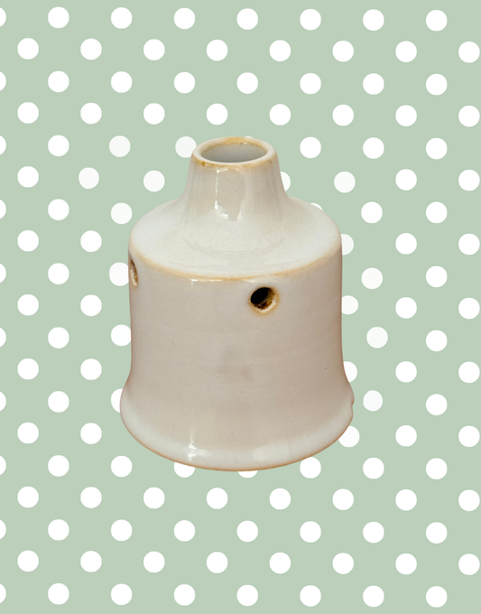 Rare vintage white ceramic pie funnel with classic steam vent design.