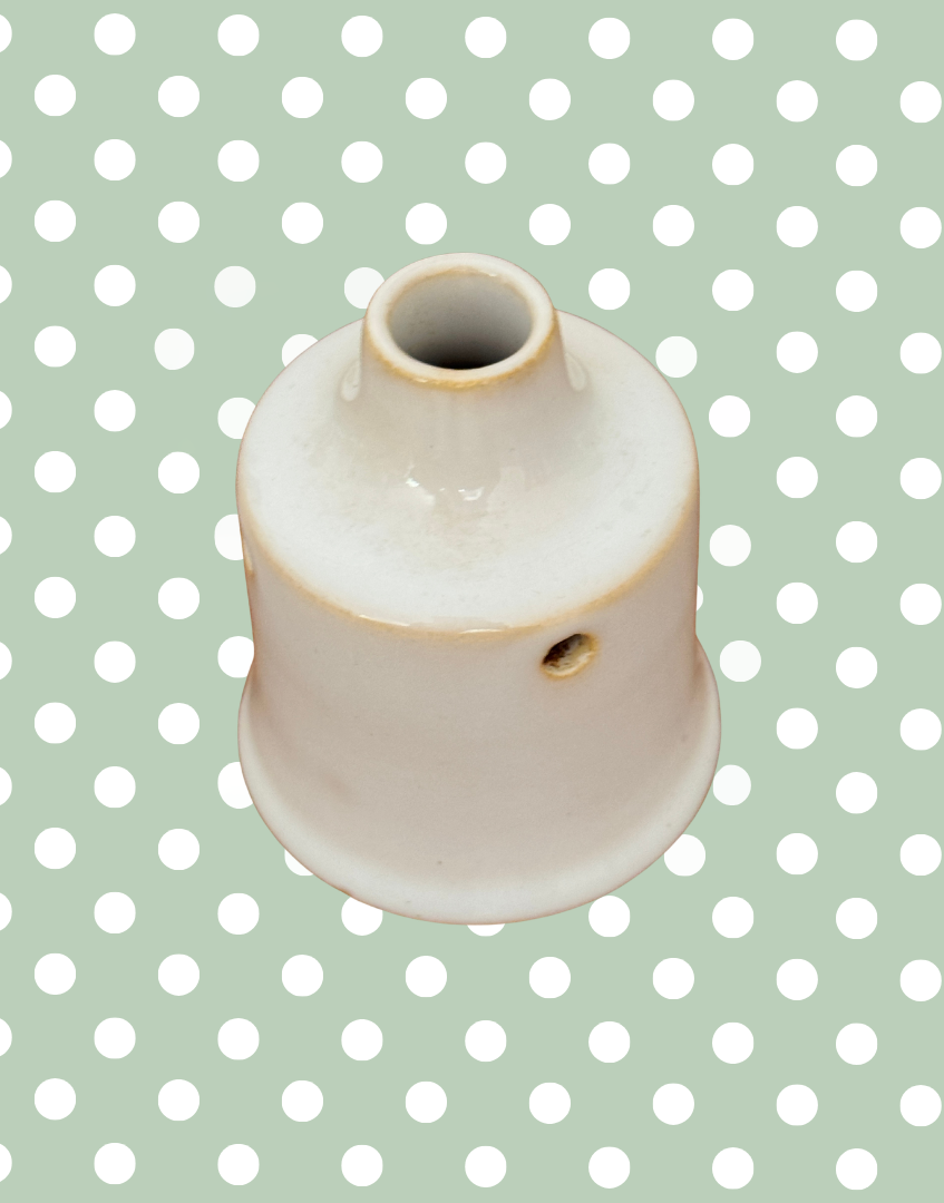 Side view of rare vintage white ceramic pie funnel.