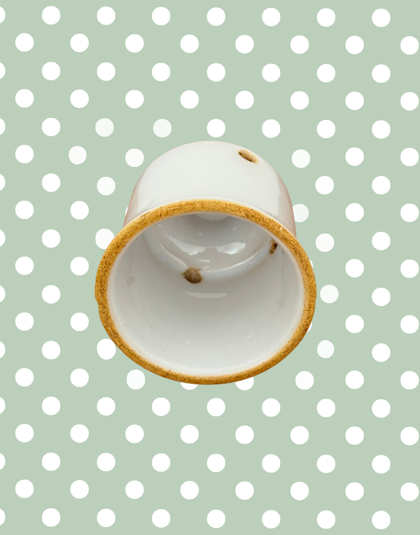 Base of rare vintage white ceramic pie funnel showing light age-related wear.