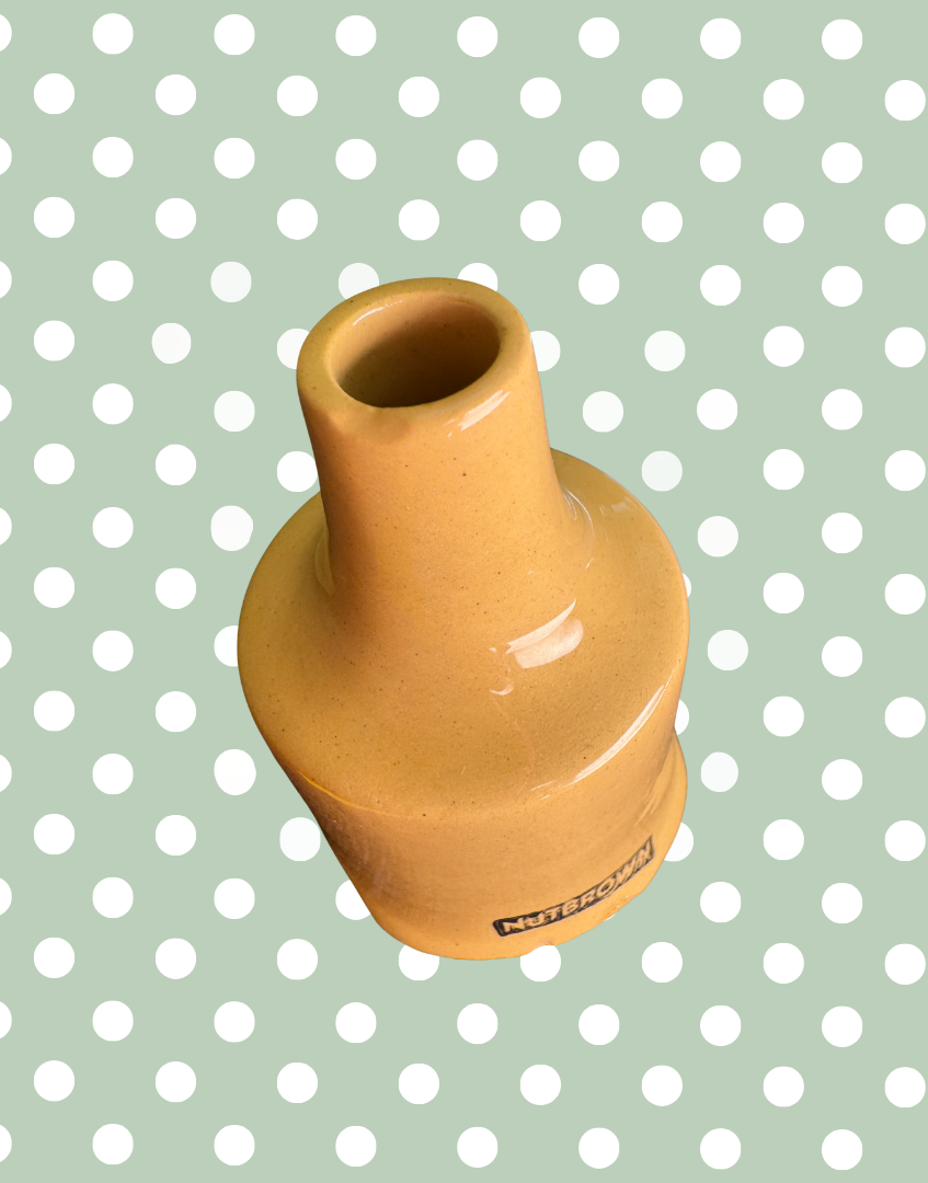 Close-up showing minor manufacturing imperfection on  chimney rim of vintage Nutbrown pie funnel.