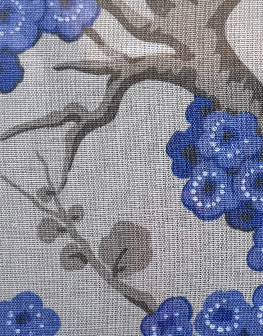 Close-up of blue floral pattern on a gray background