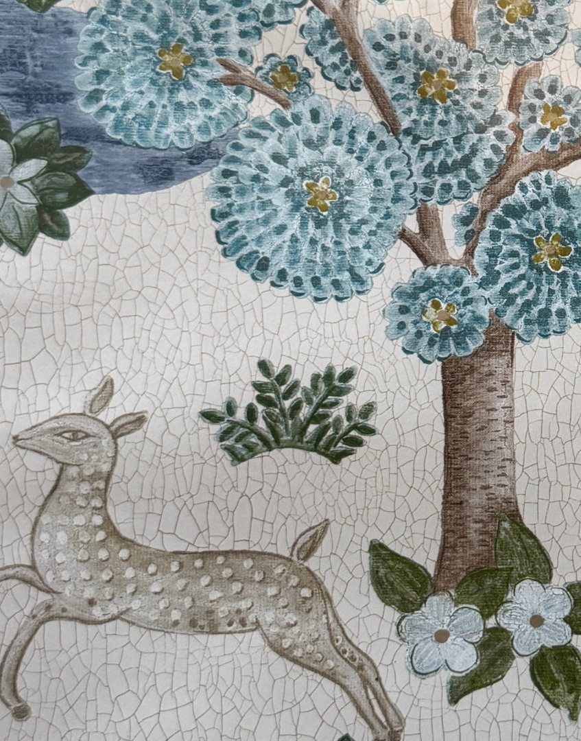 Decorative mosaic pattern with a deer, tree, and flowers on a textured background