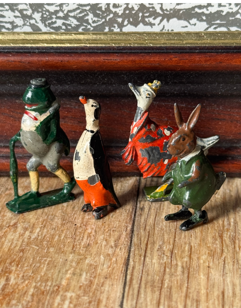 A group of vintage Cadbury Cococubs dating from the 1930s, highlighting the fascinating history of Britains lead toys and Cadbury advertising.