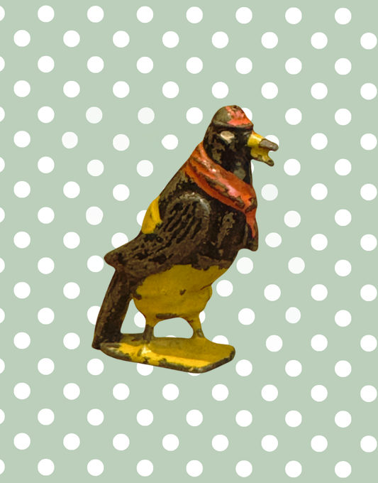 ‘Dan Crow’  Cadbury Cococub Bird Figurine with yellow trousers and red scarf and cap