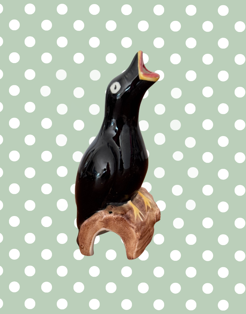 Artone pottery vintage black bird perched on a log singing pie funnel