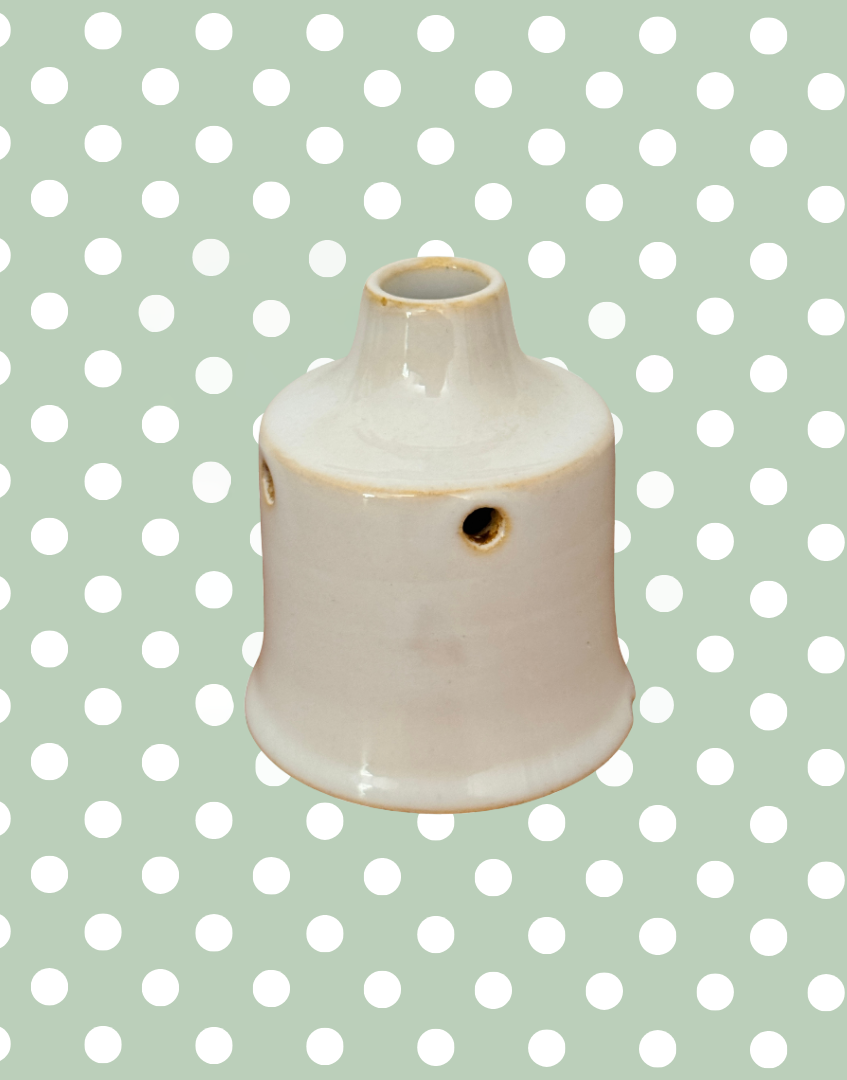 Rare vintage white ceramic pie funnel with classic steam vent design.