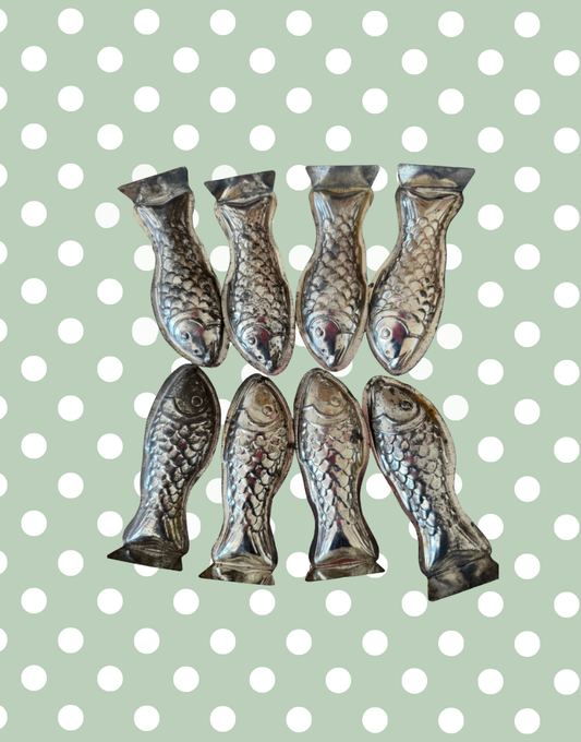 Collection of eight vintage fish shaped tinplate moulds from a set of ten European kitchenalia collectables