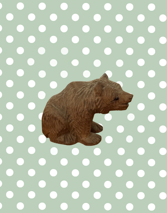 Antique German wooden bear figurine light wood tone side view