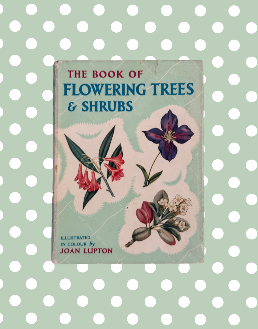 Vintage book titled 'The Book of Flowering Trees & Shrubs' by Joan Lipton, featuring botanical illustrations on a light blue cover 