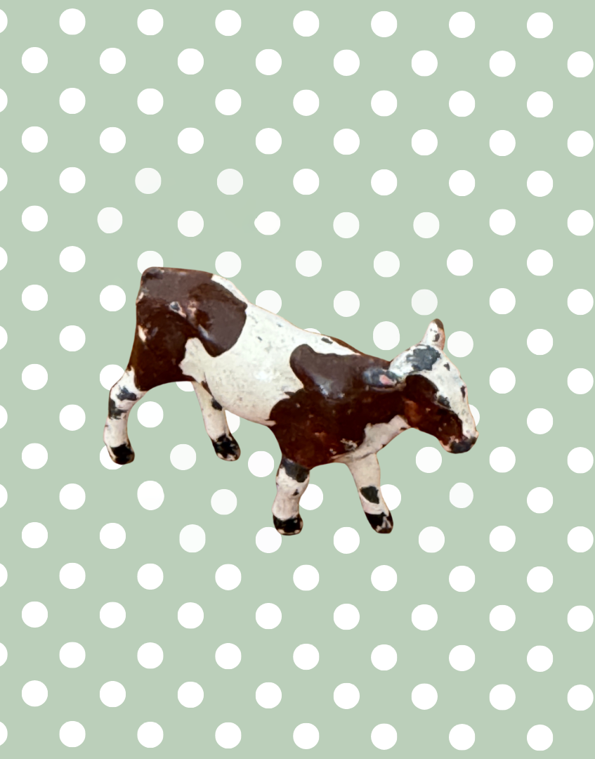 brown and white patched miniature calf lead figurine