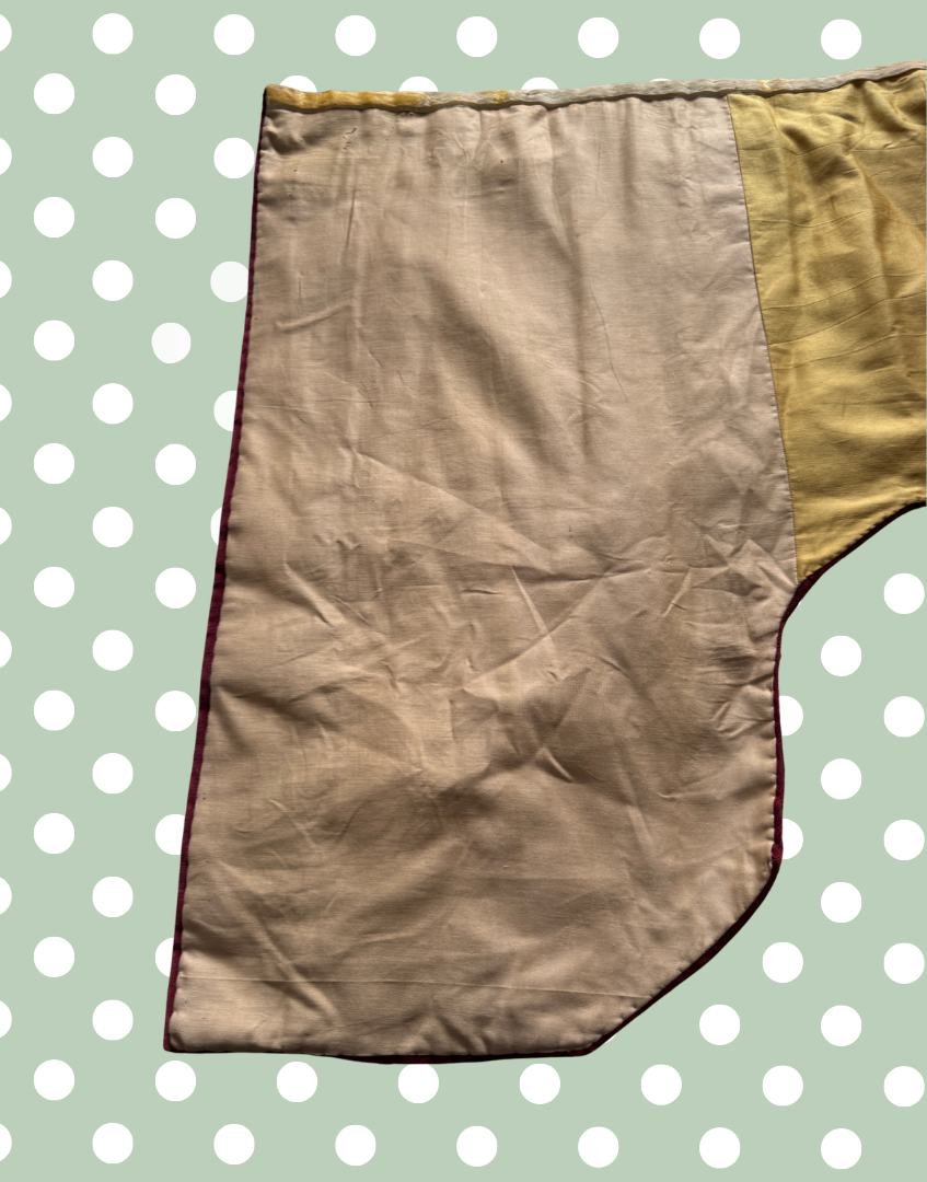 Reverse left section of the antique pelmet showing the protective lining and construction of the later adapted textile.