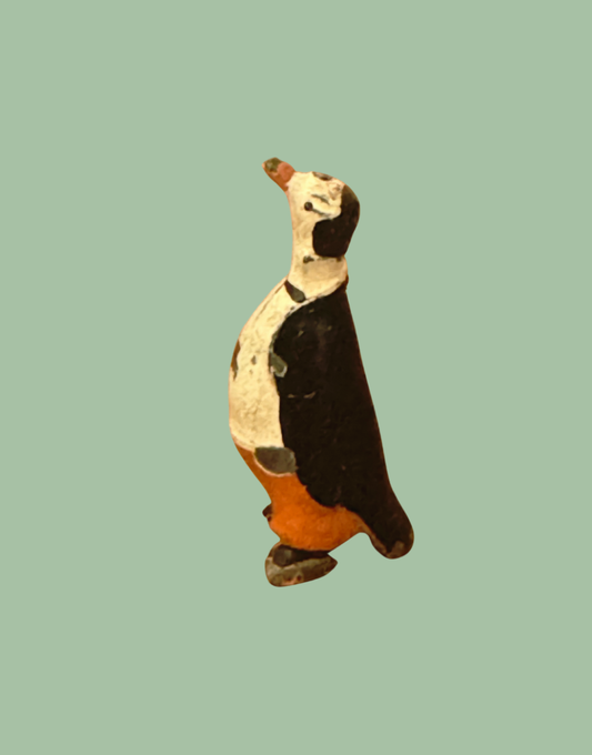 Antique Cadbury Cococub pete penguin minature hand painted lead collectable in red trousers, black tie and black dress suit