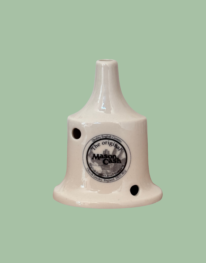 Ceramic British pie funnel with 'Mason Cash' branding 
