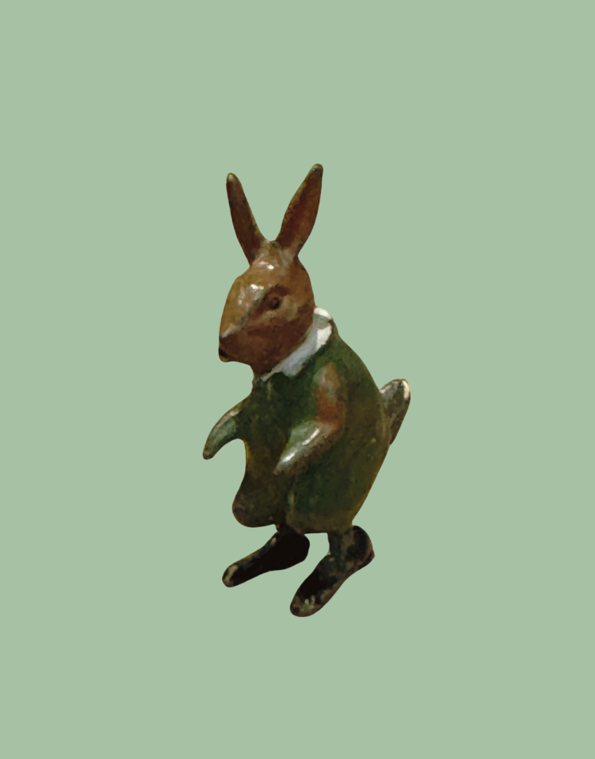 Lead hand painted brown rabbit in green dress pre war collectable toy