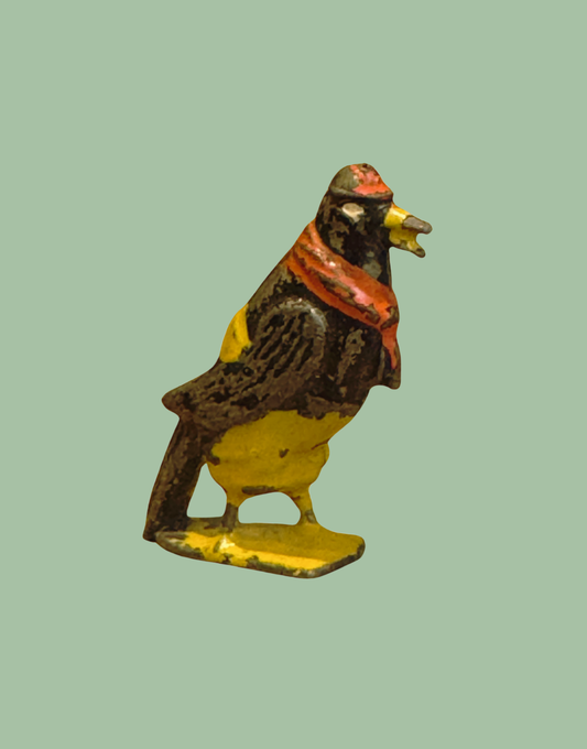 ‘Dan Crow’  Cadbury Cococub Bird Figurine with yellow trousers and red scarf and cap