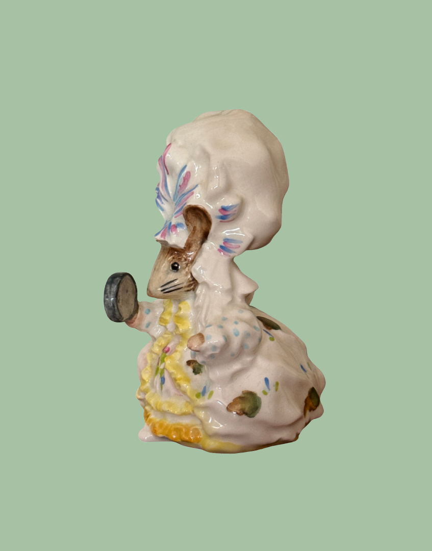 Side view of vintage Beswick Lady Mouse figurine showing hand-painted dress, bonnet and porcelain detailing