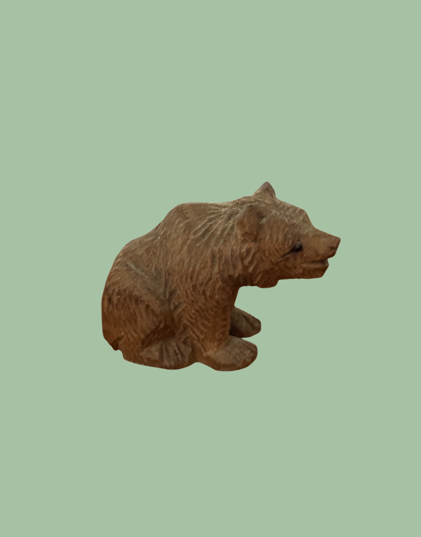 Antique German wooden bear figurine light wood tone side view