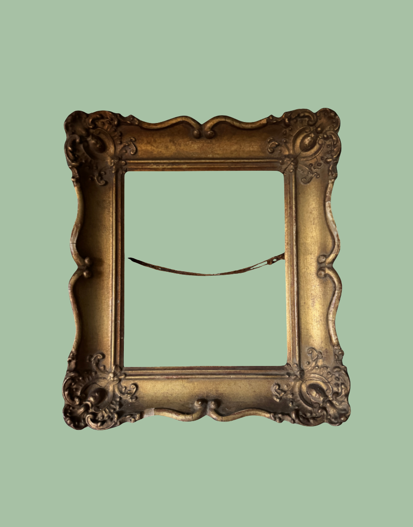 An ornate vintage-style picture frame with a distressed gold finish, shown from the back against a solid sage green background.