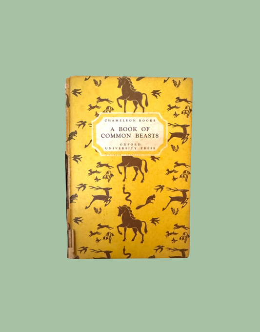 A vintage hardcover book titled 'A Book of Common Beasts' by Chalmson Books, featuring a mustard yellow cover decorated with black silhouettes of animals, set against a solid sage green background.