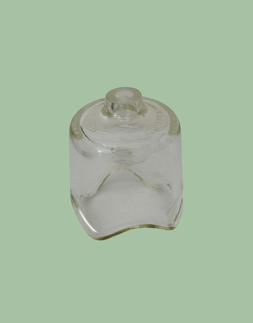 Vintage large Pyrex glass pie funnel for traditional home baking.