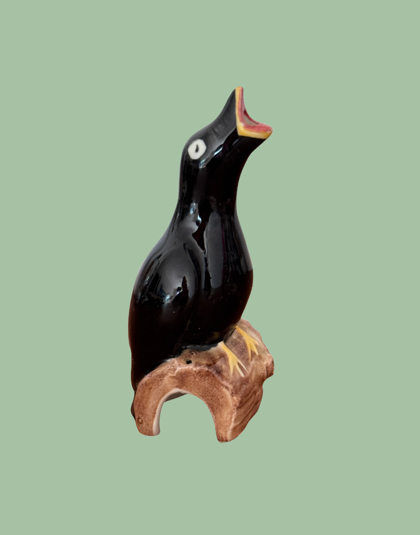 Artone pottery vintage black bird perched on a log singing pie funnel