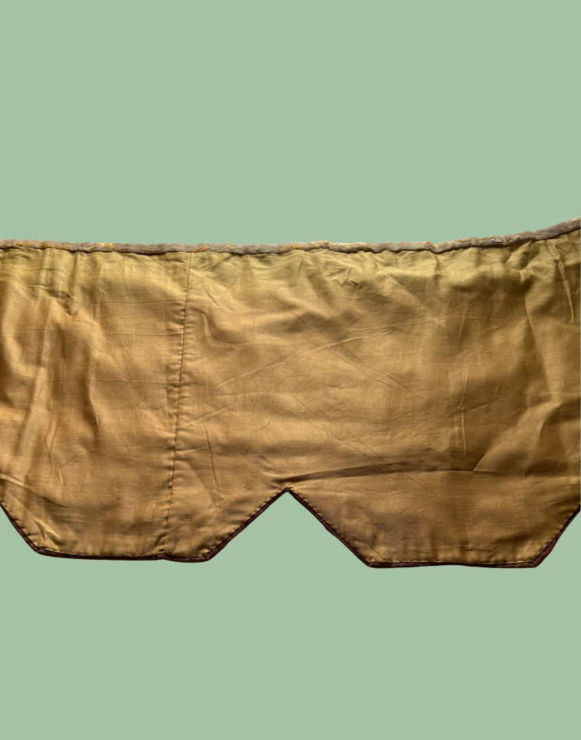 Reverse middle section of the antique pelmet showing the protective lining and construction behind the original embroidery.