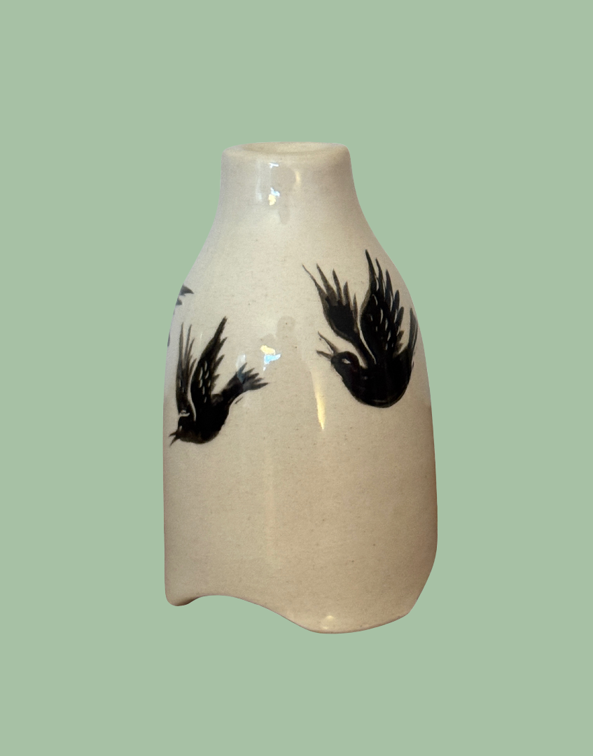 cream ceramic pie bird with blackbird illustration