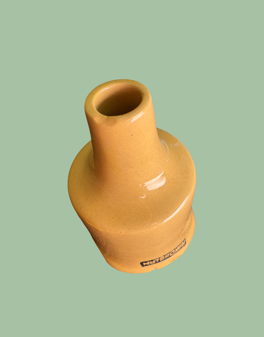 Close-up showing minor manufacturing imperfection on  chimney rim of vintage Nutbrown pie funnel.