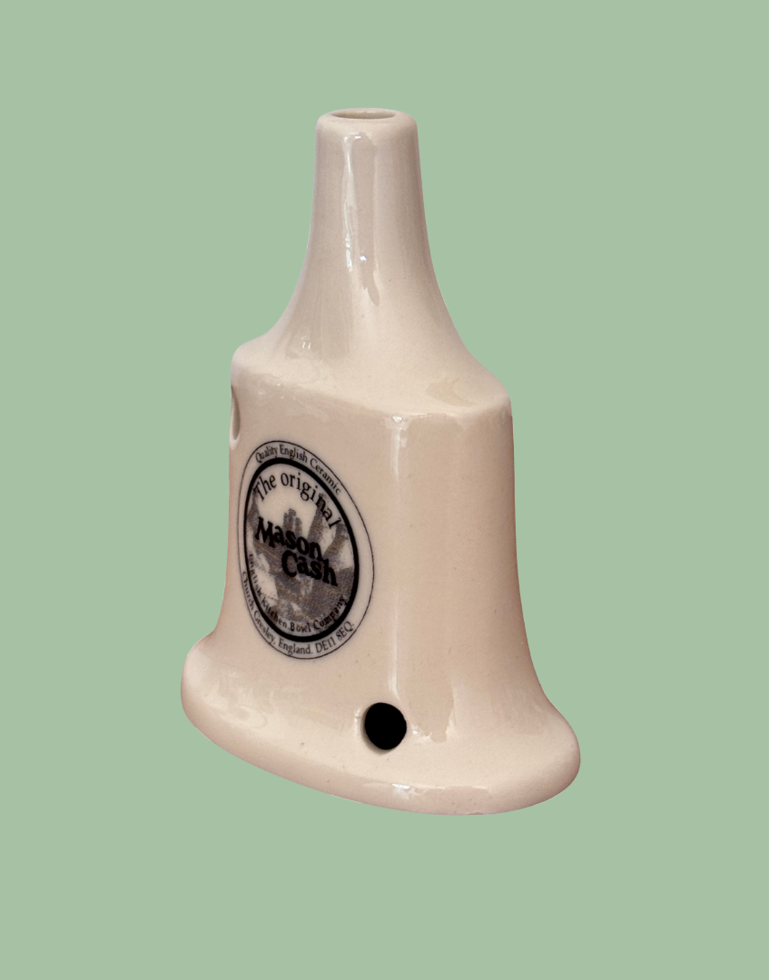 Side view of white trditional Mason Cash pie vent collectable