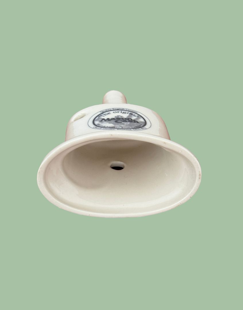 Underside base view of white ceramic vintage kitchenware baking tool