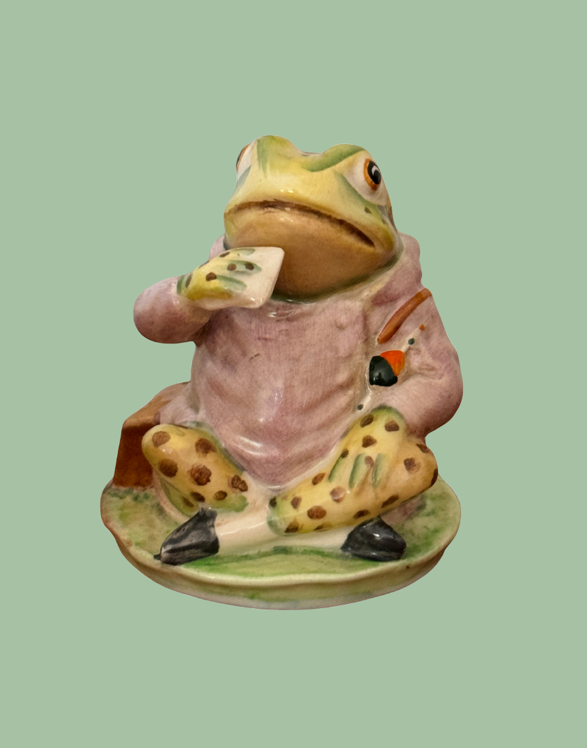 Side view of vintage Beswick Jeremy Fisher figurine showing hand-painted details and green frog character