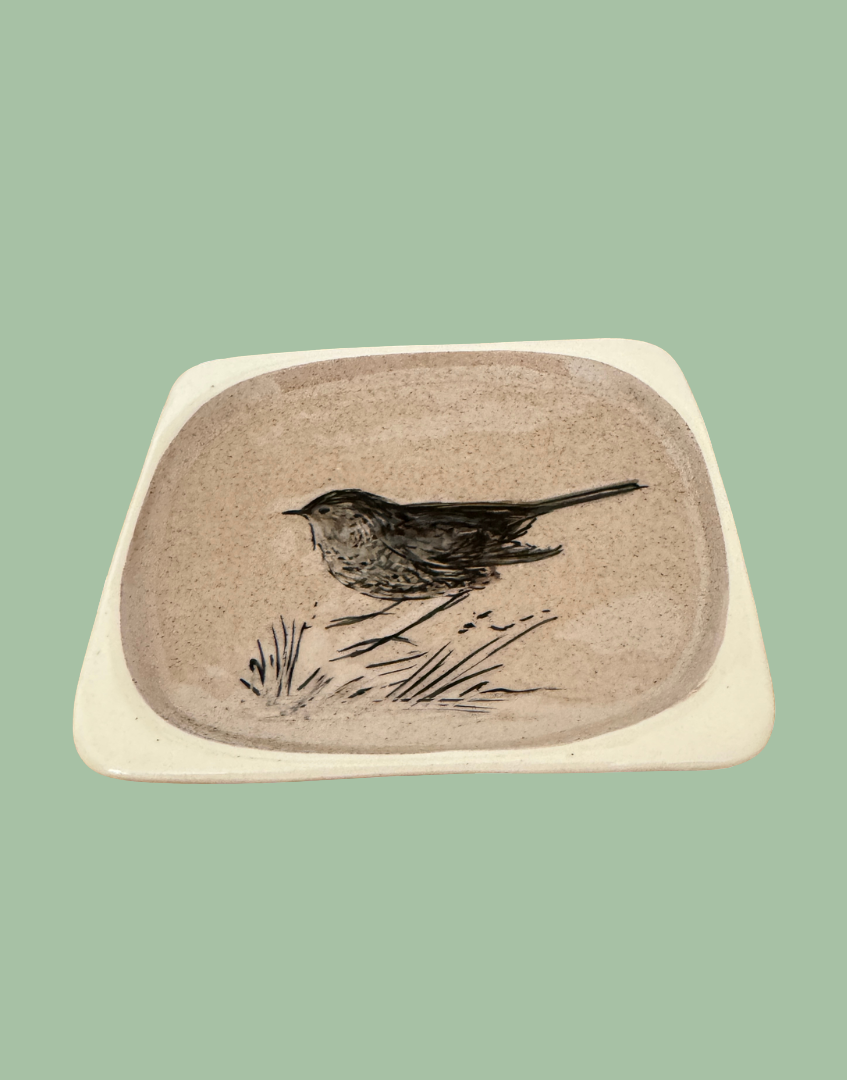 Front view of porcelain glazed wren illustrated trinket dish