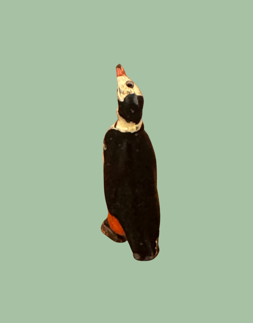 back view of small scale penguin collectable lead figurine toy