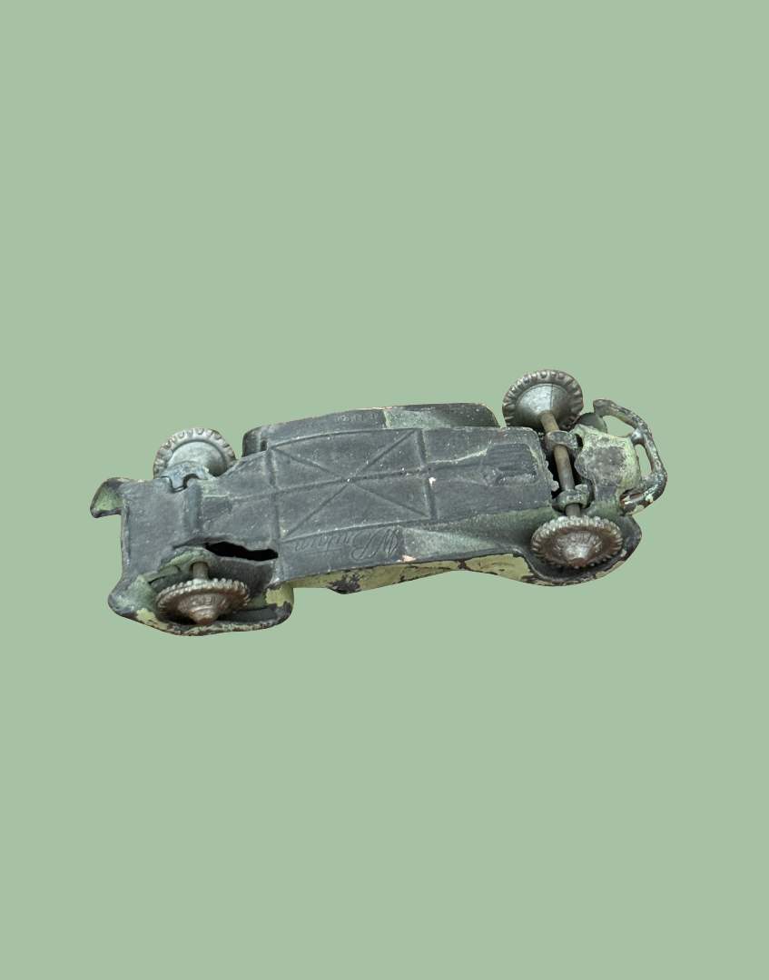 Underside view of vintage Britains lead toy car base